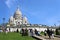 France, Paris - May 2023 - The Basilica de Sacred Heart in Montmartre and blue sky behind