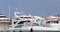 France, Port Saint-Jean-Cap-Ferrat, 29 May 2017: The elderly couple parks the yacht, a pier, megayachts on the