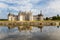 France. Royal Castle of Chambord, reflected in the water of the river