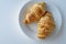 France`s national food croissant on a white plate