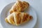 France`s national food croissant on a white plate