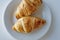 France`s national food croissant on a white plate