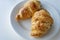 France`s national food croissant on a white plate