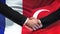 France and Turkey handshake, international friendship relations, flag background