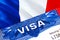 France Visa in passport. USA immigration Visa for France citizens focusing on word VISA. Travel France visa in national