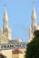 Francisco street sign against the bells towers of Saints Peter a