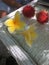 frangipani flowers and exotic fruit on a table in a hotel in bali