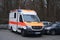 Frankfurt, Germany - January 2022: modern Red paramedic ambulance emergency service vehicle, medics provide assistance, concept of