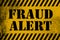 Fraud Alert sign yellow with stripes