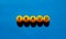 Fraud symbol. Orange table tennis balls with the words `fraud`. Beautiful blue background, copy space. Warm sunshine. Business,