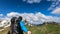 Frauenkogel - Male adult hiking to the summit of Frauenkogel with view on the Karawanks in Carinthia. Selfie stick