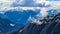 Frauenkogel - Panoramic view on the Karawanks in Carinhtia. Clouds covering the peaks