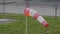 Frayed windsock in moderate wind on the airfield