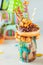 Freak shake with chocolate donut on party background