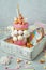 Freak shake decorated as unicorn in the wooden box filled with p