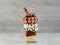 Freakshake with donuts on gray wooden background