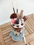 Freakshake, a kind of gourmet Milkshake with topping : donut, whipped cream, chocolate ball, wafer biscuits, candy, mikado, mini i