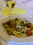 Frech homemade spaghetti pasta with vongole sea sheels and small red tomatoes