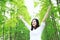 Free carelss happy woman hug nature in forest outdoor enjoy fresh air