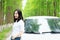 Free carelss happy woman stand by a white car, safe drive concept, enjoy cozy comfortable life