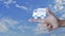 Free delivery truck flat icon on finger over blue sky with white clouds, Business transportation concept