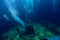 Free diver man dive at shipwreck, underwater sea