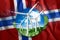 Free energy, windmills against the background of nature and the flag of Norway. The concept of clean energy, renewable energy