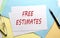 FREE ESTIMATES text on paper on the colorful paper background