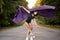 Free flight. Graceful classic ballerina dancing on road in forest. grace, artist