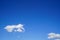 Free form floating white cloud as per imagination with bright blue sky background on sunshine day