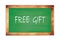 FREE  GIFT text written on green school board