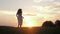 Free Happy Caucasian Woman In White Dress Runs Across Field To Meet The Sunset