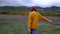 Free Happy Young Hiker Woman looking up with raised arms enjoying calm rainy day