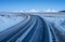 Free highway in morning time and snowed mountains on horizon