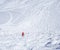 Free ride piste with skier in red clothes skiing downhill on snow covered slopes from the top of Kitzsteinhorn mountain