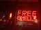 Free smells neon sign abstract ironic paradox clever red city shop scent storefront