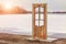 Free-standing door in nature against the backdrop of a frozen lake in winter. door to another world