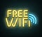 Free wifi neon luminous signboard on bricklaying wall.