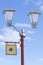 Free WiFi - wireless internet sign on the lamppost on blue sky background