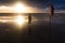 Free woman enjoying freedom feeling happy at beach at sunset. Beautiful serene relaxing woman in pure happiness and