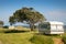 Freedom camping in caravans at an East Coast beach, Gisborne, North Island, New Zealand