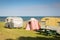 Freedom camping in caravans and tent at an East Coast beach, Gisborne, North Island, New Zealand
