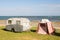 Freedom camping in vintage caravan and tent at an East Coast beach, Gisborne, North Island, New Zealand