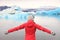 Freedom happy woman at glacier lagoon on Iceland