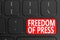 Freedom Of Press on black keyboard