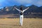 Freedom woman with raised arms enjoying fantastic view of mountains range