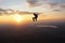 Freefly skydiving. Skydiver is sitting in the sky.