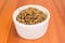 Freekeh in a ramekin in wood background