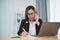 Freelance business woman calling on mobile smartphone while working with laptop, businesswoman mobile phone to calling with