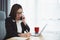 Freelance business woman calling on mobile smartphone while working with laptop, businesswoman mobile phone to calling with